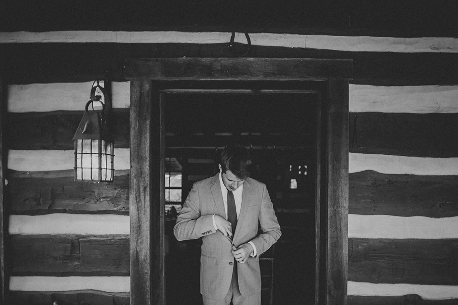 groom fixing tie